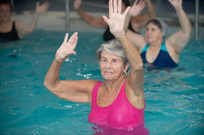 Becoming Center member exercises in the heated pool