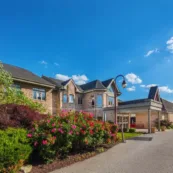 flowers and shrubs by the artman front entrance